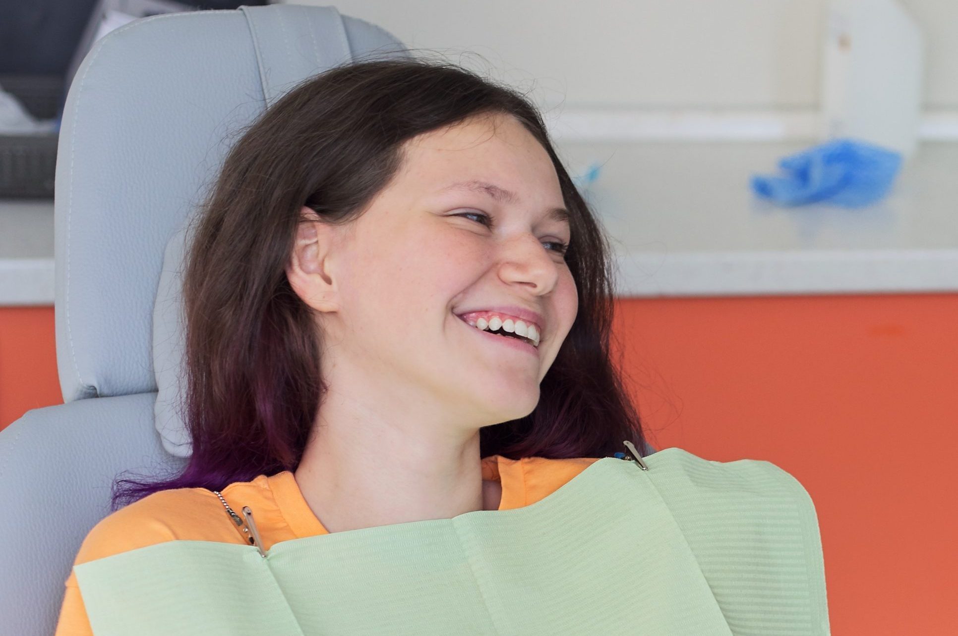 Teenager girl treating teeth at dentist office, consultation of orthodontist. Dentistry, healthy teeth, medicine and healthcare concept